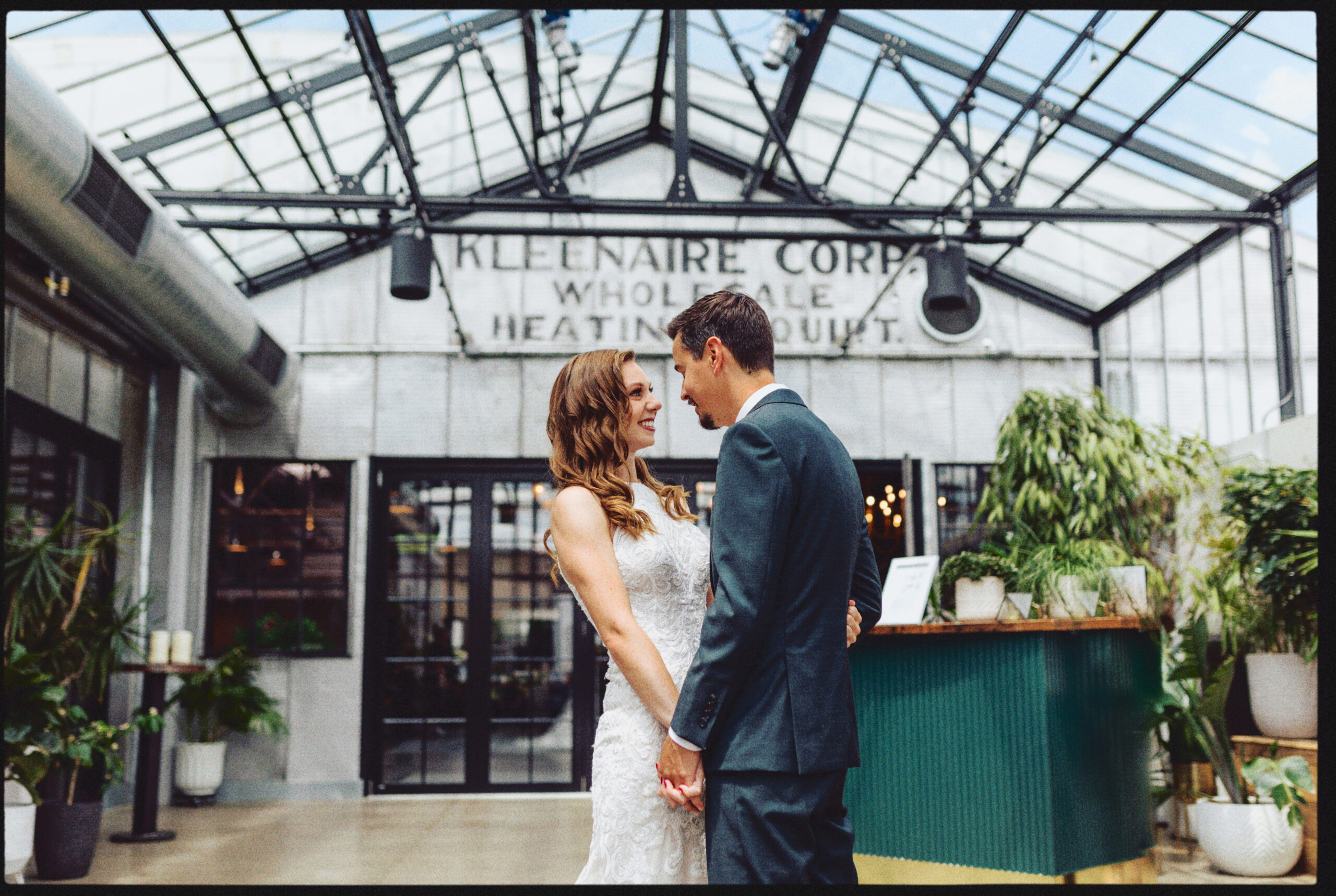 Bride and Groom First Look at the Tinsmith in the Atrium