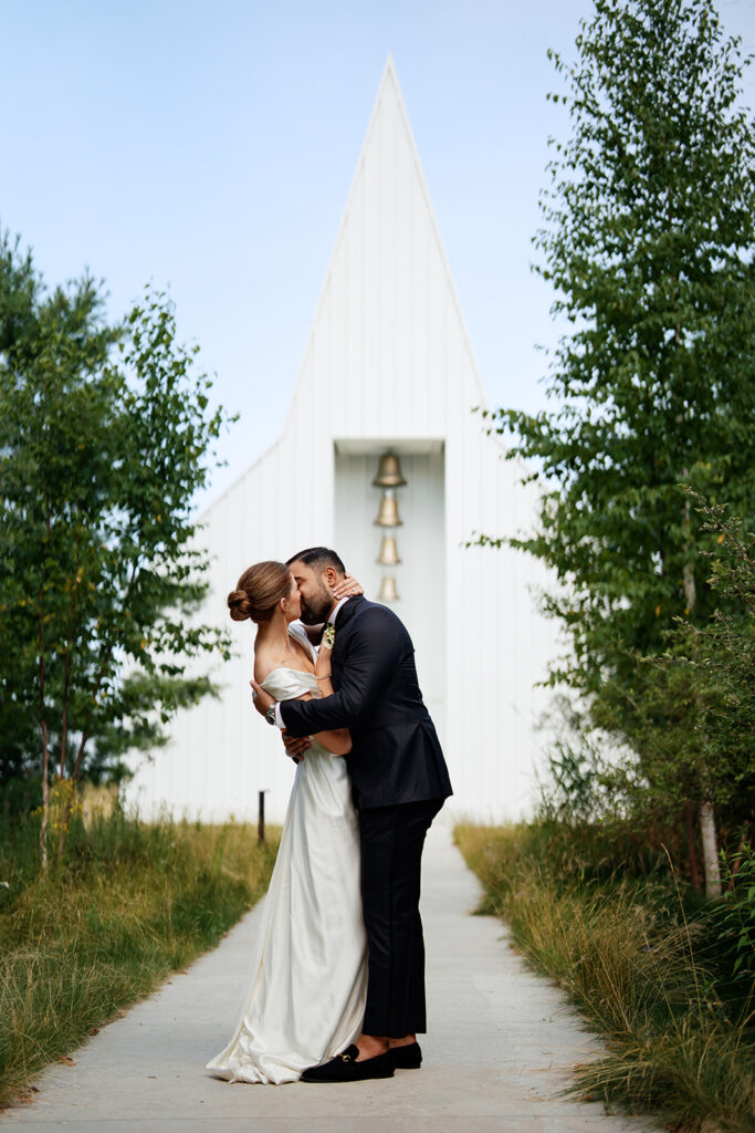Bride and groom in front of Straits chapel, one of the best wedding venues in madison and milwaukee